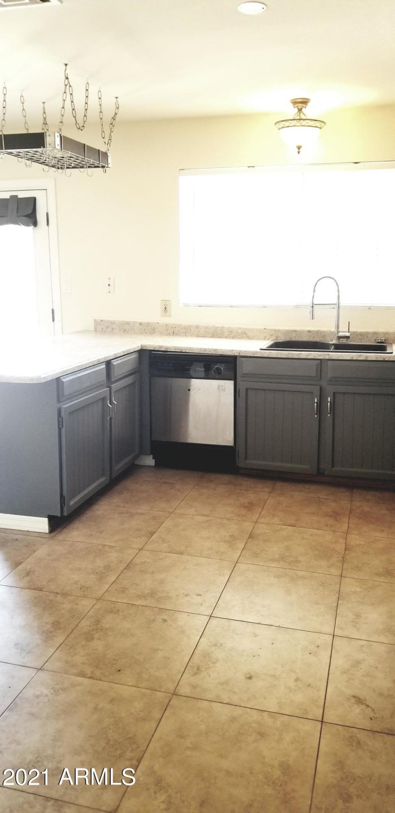 Kitchen overlooking backyard