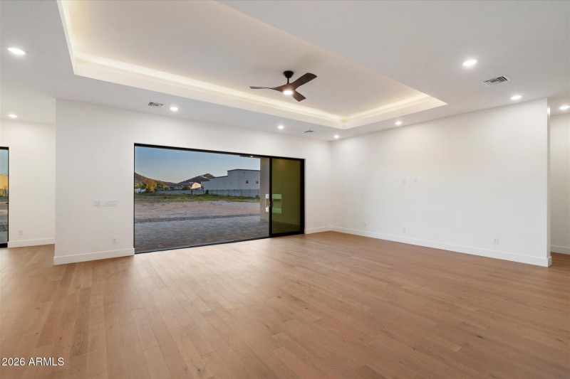 LR w Wood Floors & Sliding Glass Door