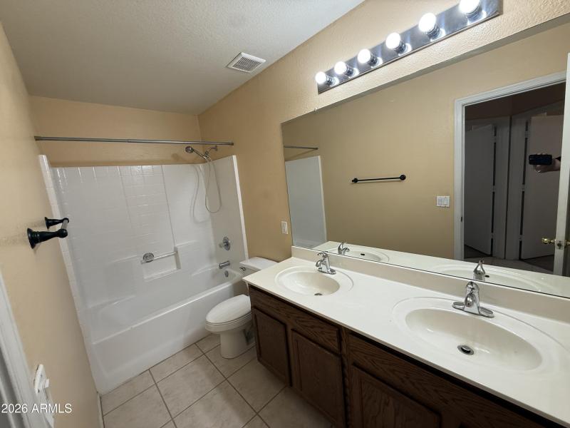 Full Bathroom With Dual Sinks