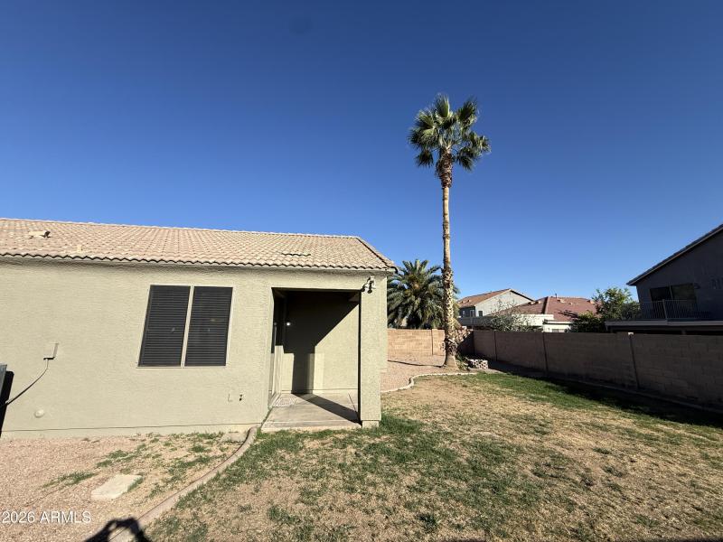 Covered Patio & Backyard Lawn