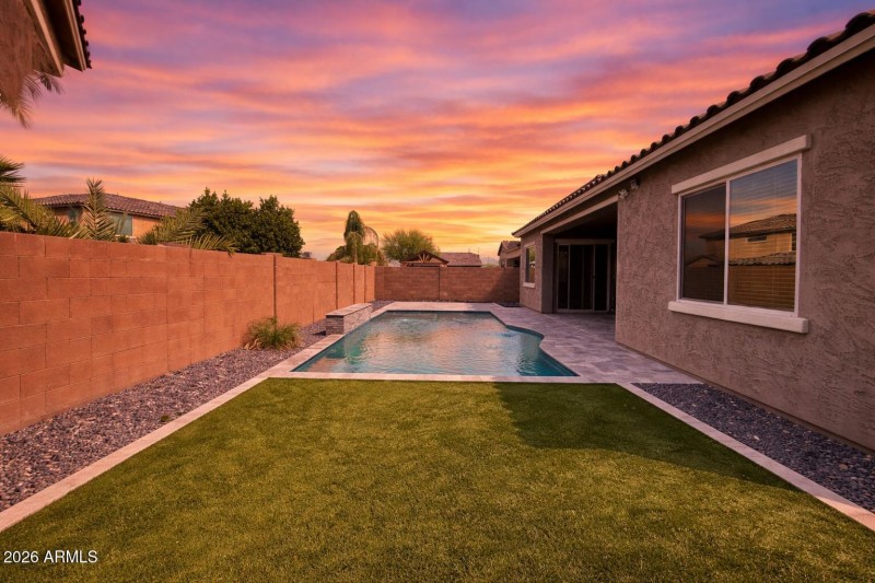 Sunset pool oasis in backyard