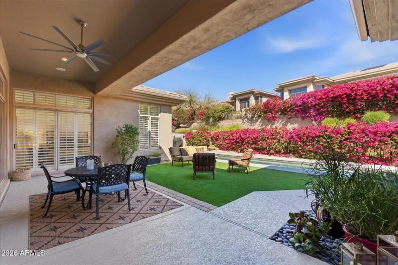 Covered Patio and Lush Back Yard