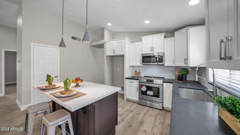 KITCHEN WILL HAVE A STAINLESS REFRIGERAT