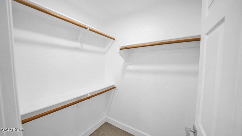 WALK IN CLOSET IN MASTER BEDROOM