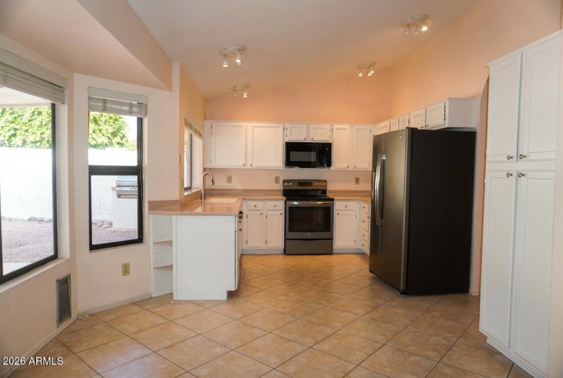 Kitchen w/ White Cabinets