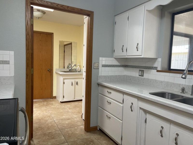 Laundry with sink and storage
