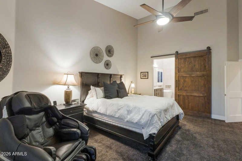 Primary suite new barn door to bath.