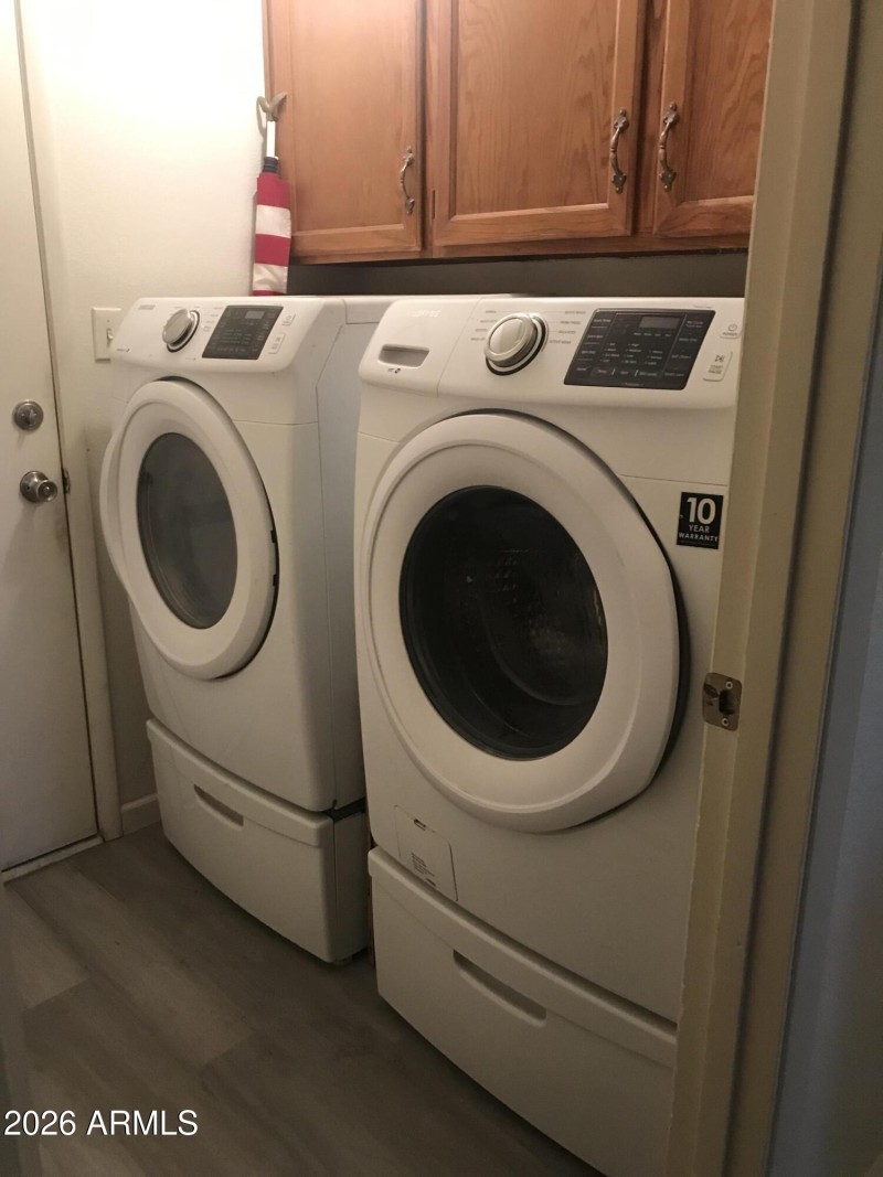 Laundry room next to garage