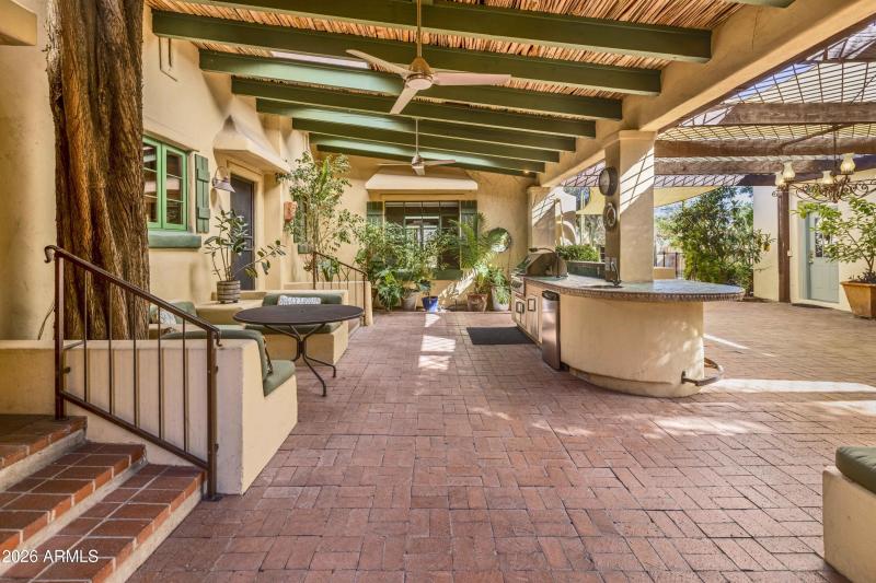 Outdoor Kitchen with Multiple Seating Ar