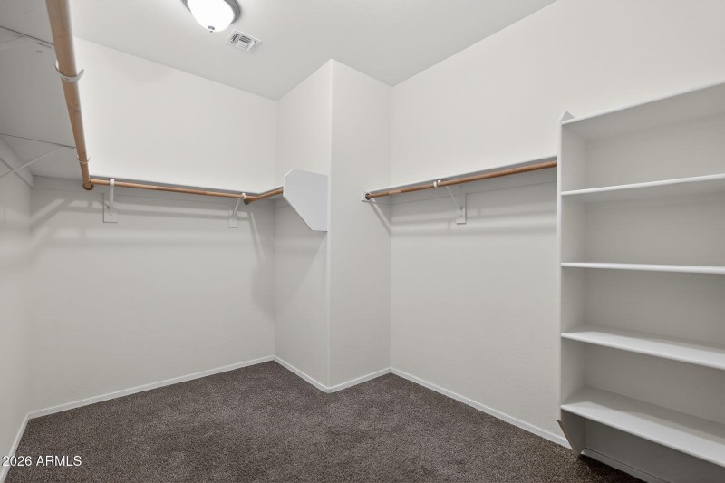 Large closet with built in shelving