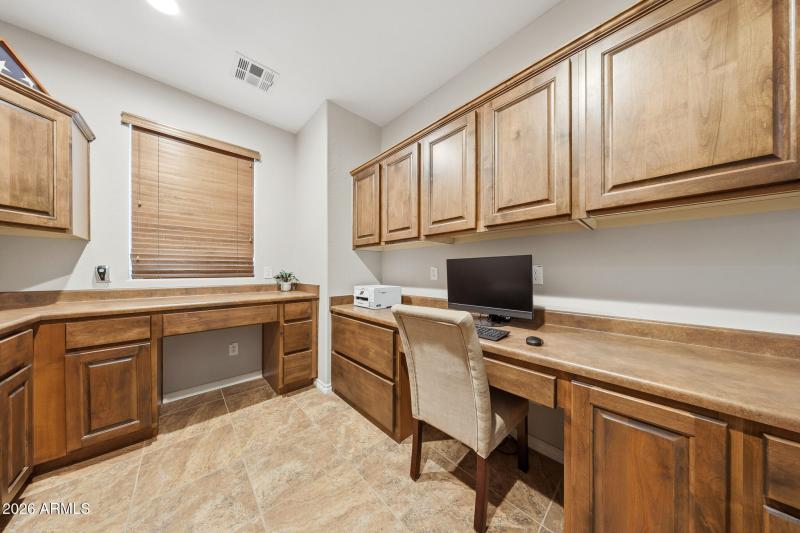 Huge laundry room with desk and storage