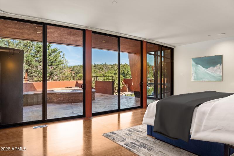 PRIMARY BEDROOM WITH SPA AND POOL ACCESS