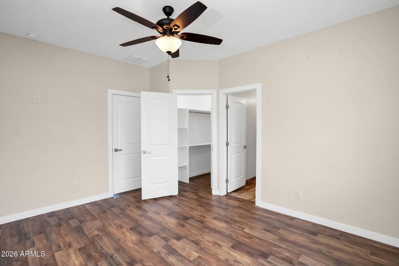 Primary View into Walk in Closet