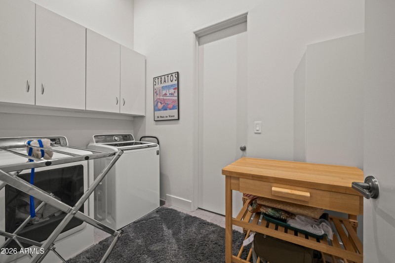 Laundry Room adjoins to Primary Closet 1