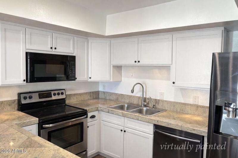 Modern L-shaped kitchen with stainless s
