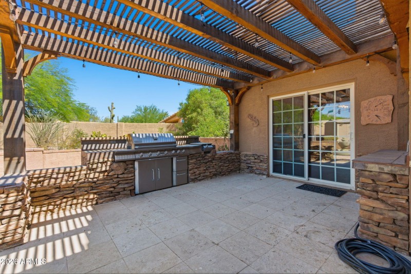Covered patio with grill and prep area