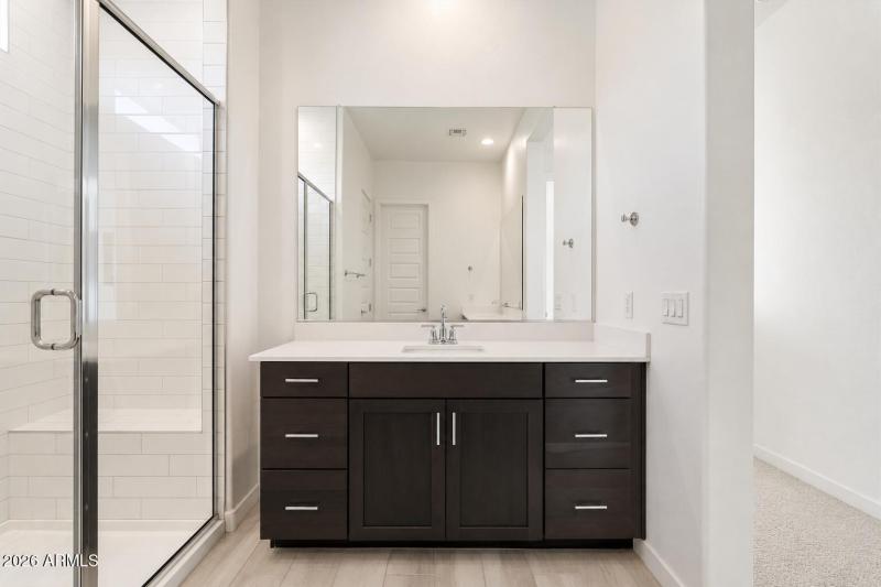primary bathroom with separate vanities