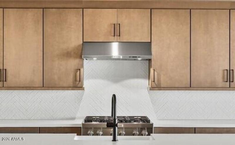 White Brick Herringbone Backsplash