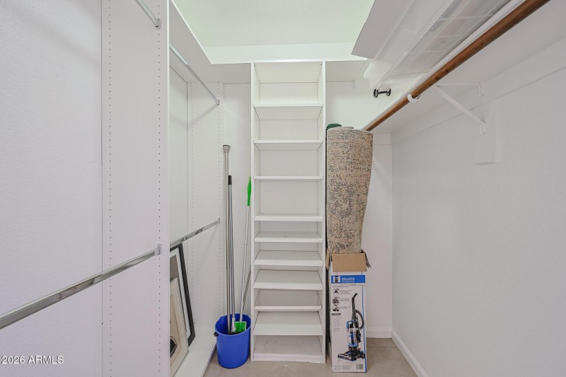 WALK-IN CLOSET IN PRIMARY BEDROOM