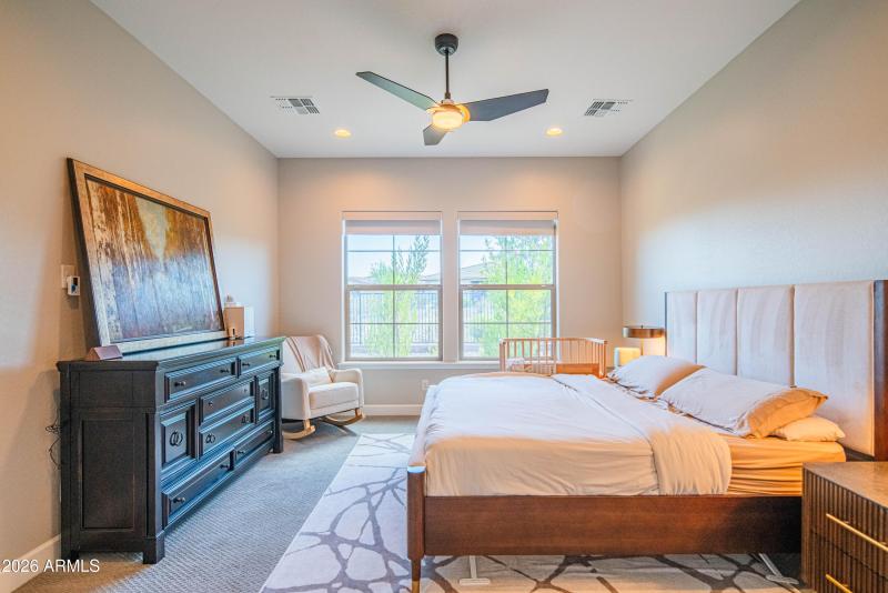 Large primary bedroom with a view