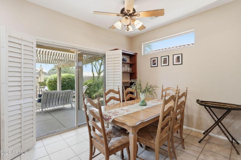 Dining area overlooks backyard oasis