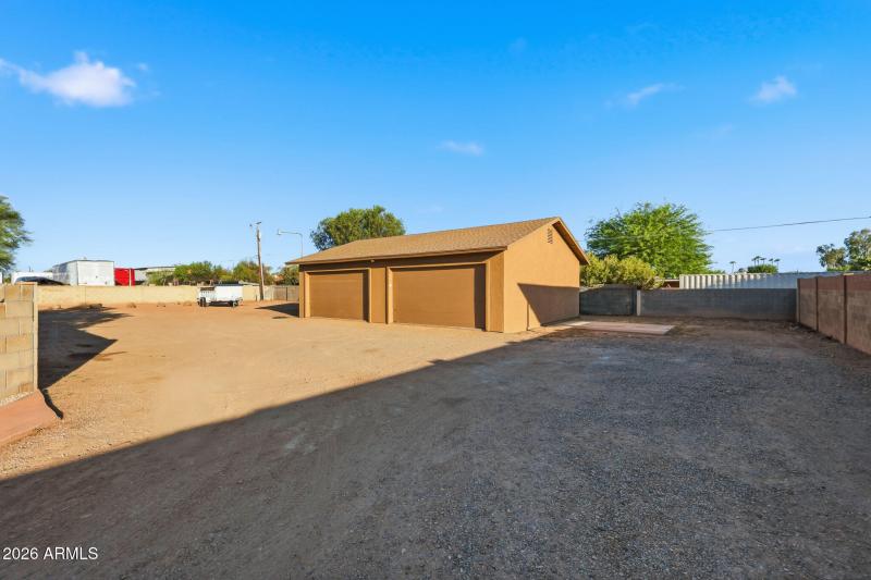 Detached 4 Car Garage & Back Lot