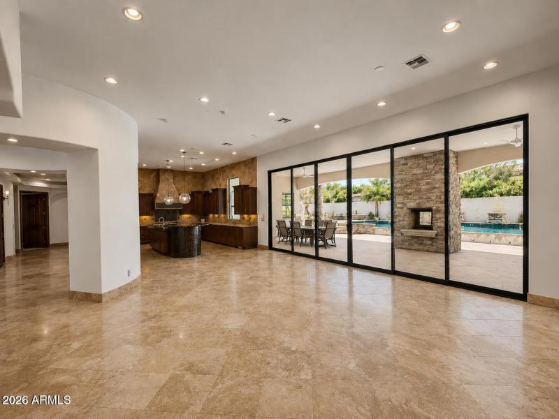Family Room/ Fireplace view into Kitchen