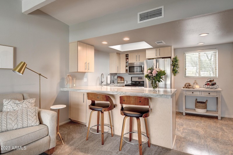 Kitchen w/Bar Seating & Skylight