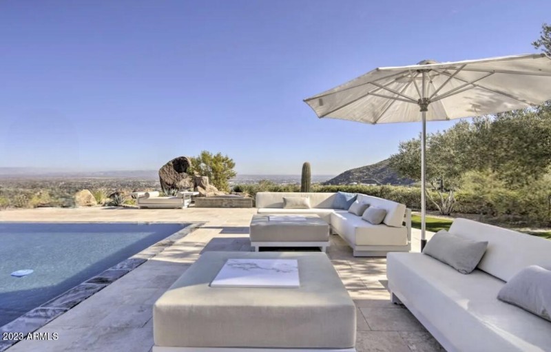 lounge chairs with pool and view