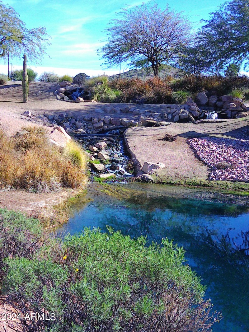 Red Mtn Ranch lake with a waterfall