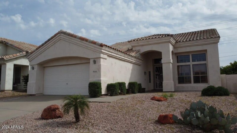 front of house with 2 car garage