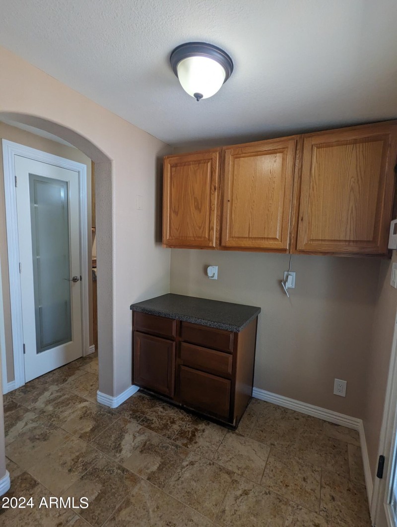 Laundry room with builtin cabinets