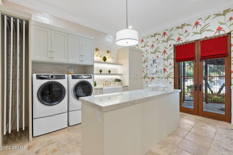 Laundry room with large prep island
