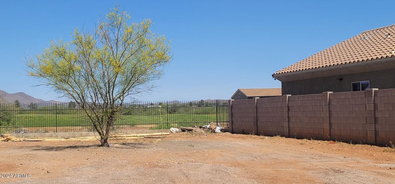 Camino del Rancho lot 51 metal fence and
