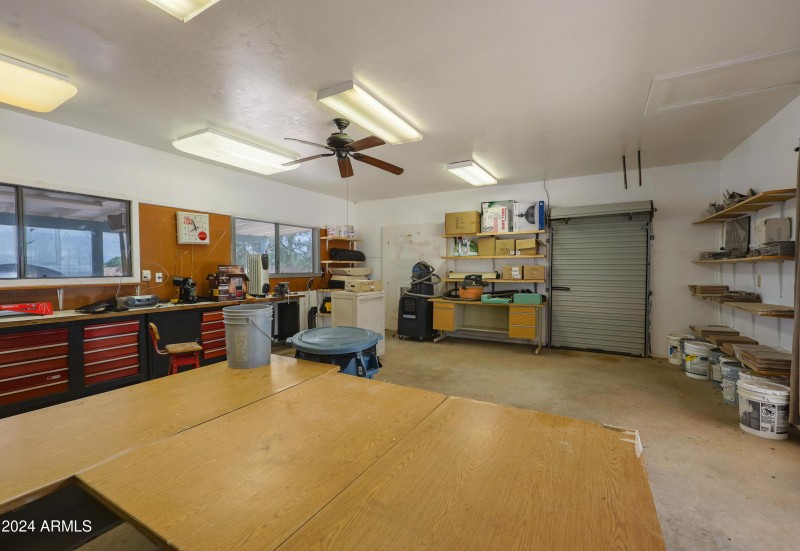 Workshop with 3 golf cart garages