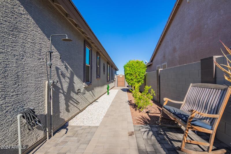 Outdoor shower and walkway to gate