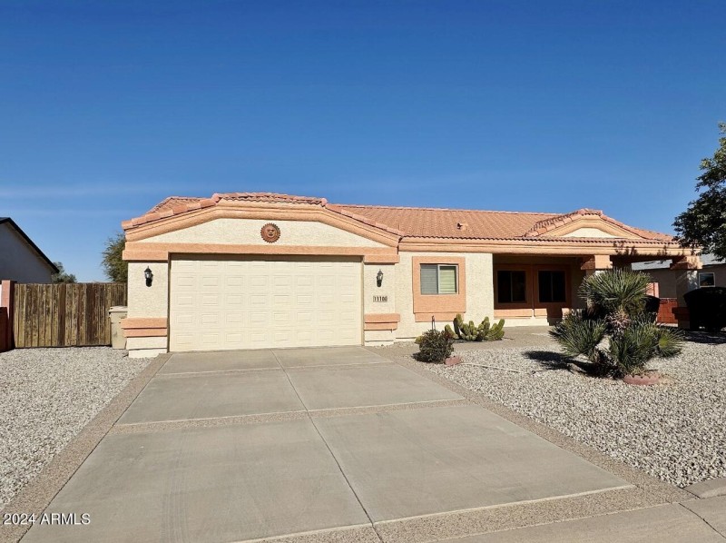 Front of home with RV gate and parking