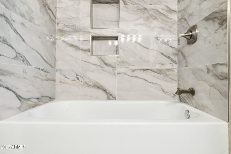 Elegant Tub with Tile Surround