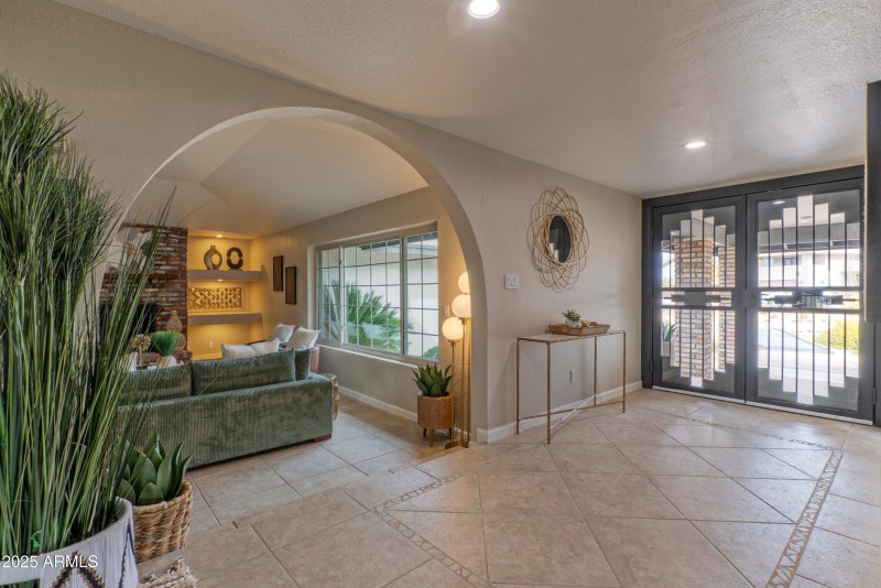 Foyer flows to living room