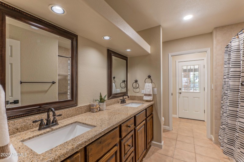 Hall bath dual sinks, tub and shower