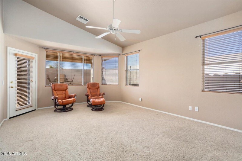 Primary Bedroom Has Bay & Door to Patio