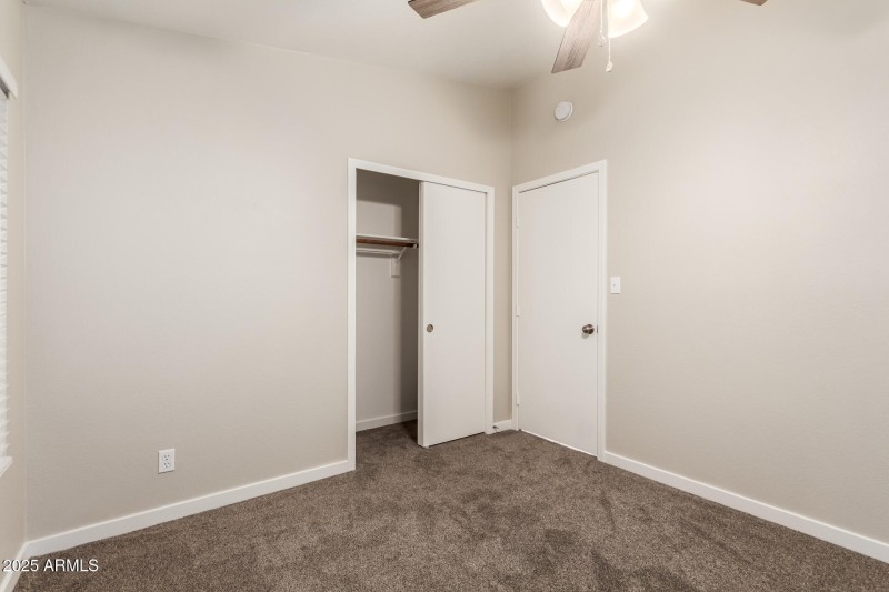 Bright Guest Bedroom With Fan
