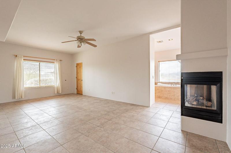 Primary bedroom west of kitchen