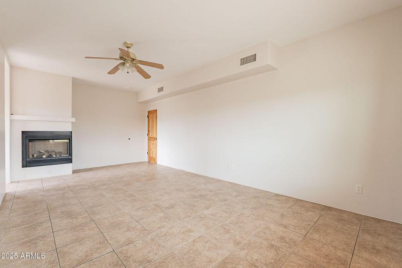 Primaty bedroom with gas fireplace