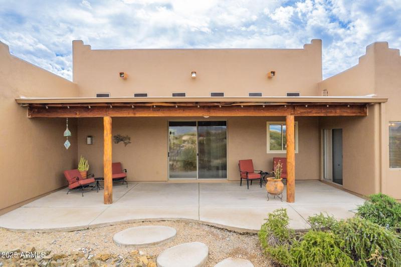 Back patio off of great room and primary