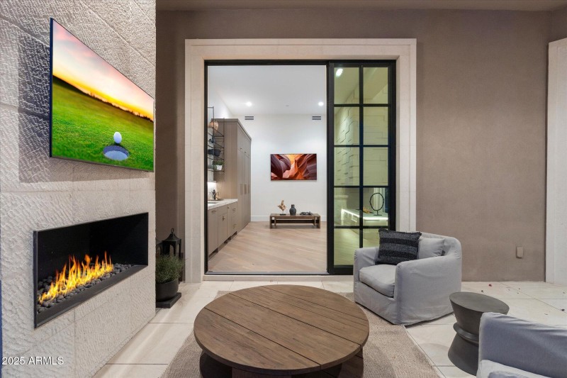 Patio seating with TV and fireplace