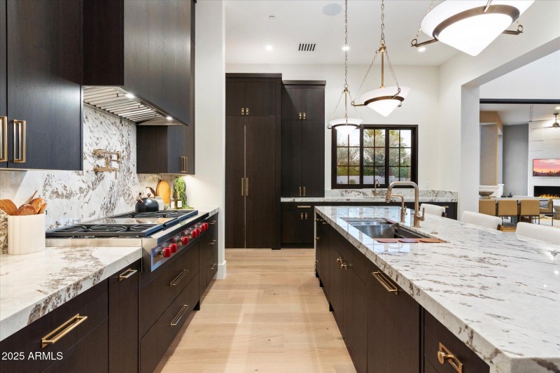 Pantry beyond behind disappearing doors