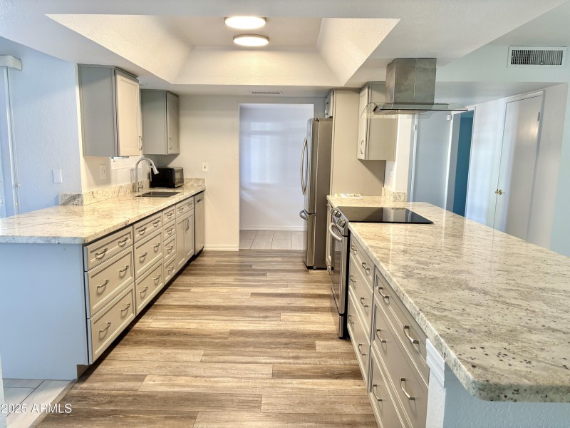 Granite and gray cabinets