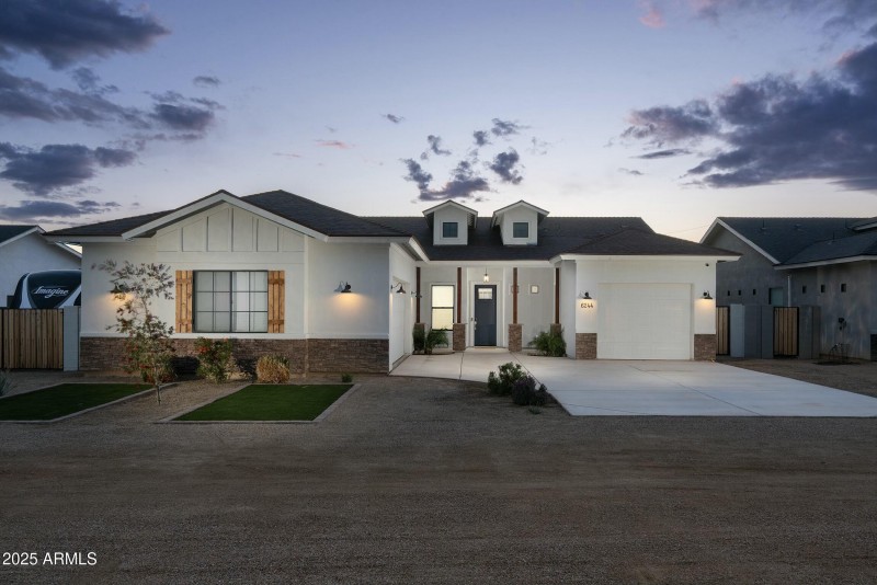 Front with three car garage & RV parking