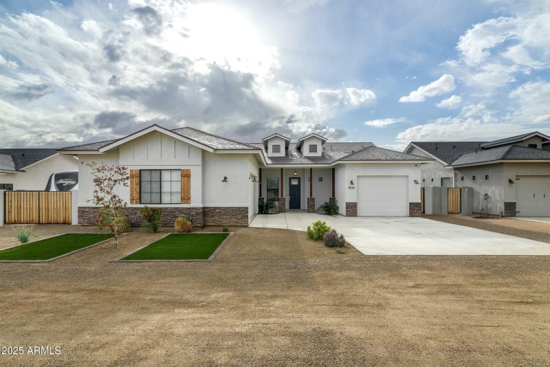 Front of house with RV gate